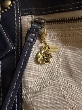 Tea Rose Bag Charm. An ancient gold-tone metal handbag accessory or zipper pull